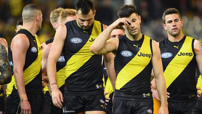 Trent Cotchin leads Richmond off the MCG.