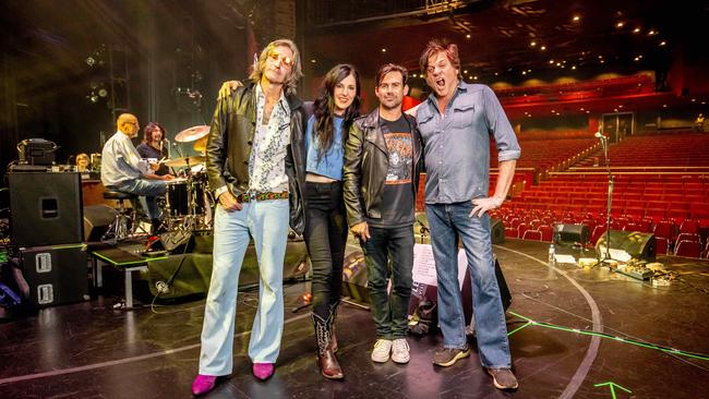 The Sticky Fingers crew ahead of the Gold Coast show in April. L-R Tim Rogers, Adalita Srsen, Phil Jamieson, and Tex Perkins, with drummer Hamish Stuart behind them. Picture: Luke Marsden.