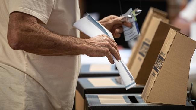 A voter casts their ballot at the 2023 NSW election. The NSW Electoral Commission has warned of a risk of “election delivery failure” after its funding proposals were rejected by the Minns government. Picture: Julian Andrews