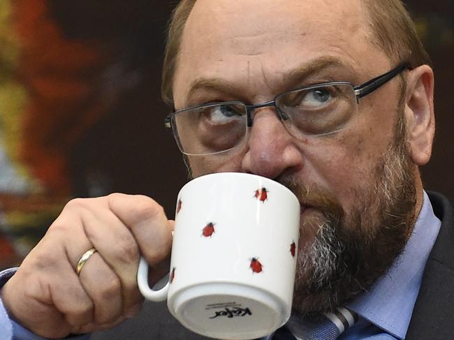 European Parliament President Martin Schulz drinks from a cup prior to a parliamentary group meeting of the SPD in Berlin on July 16, 2015 the day before German lawmakers vote in the Bundestag on entering into negotiations on the new aid package for Greece. AFP PHOTO / TOBIAS SCHWARZ