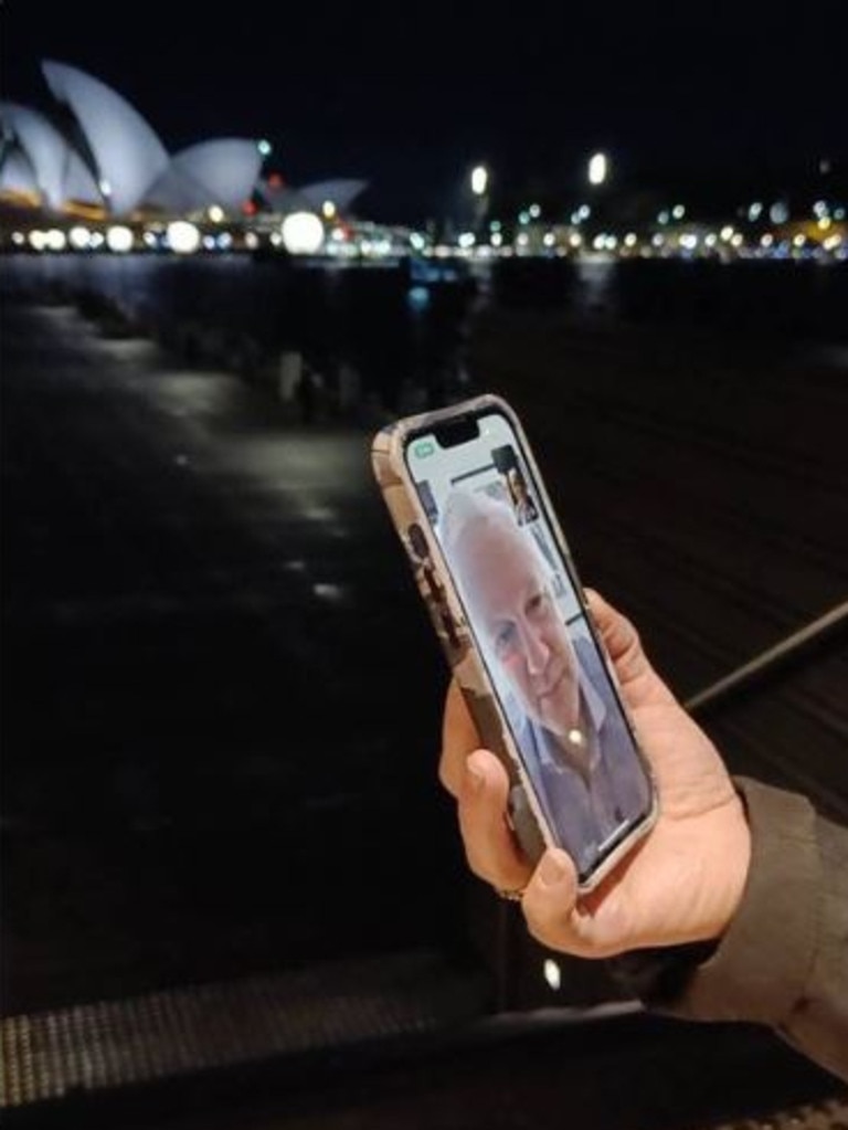 Stella Assange, wife of Julian, posts a picture of herself facetiming her husband from a secret Sydney location with the Opera House in the background. Picture: X