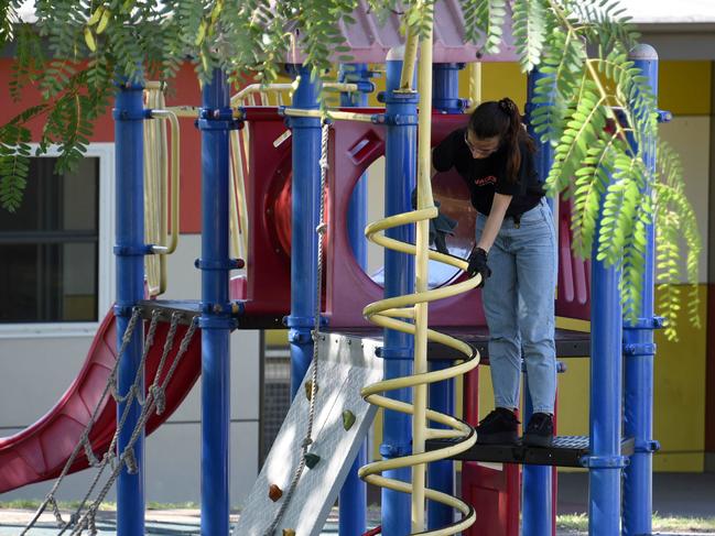 Cleaning Staff at the Helensvale State Primary School after a case of Corona Virus. (Photo/Steve Holland)