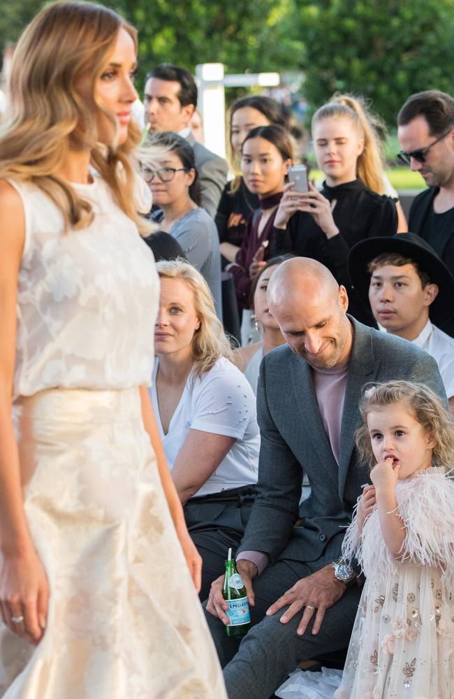 Chris and daughter Billie watch on with pride.