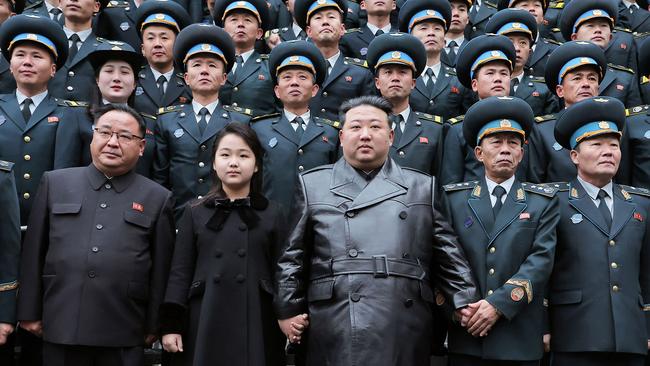 North Korean leader Kim Jong-un and his daughter pose with scientists after launching a reconnaissance satellite, reportedly aided by Russia according to South Korea’s spy agency. Picture: KCNA/KNS/AFP