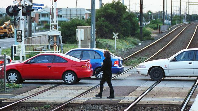 Before – a pedestrian crosses the tracks at Carrum.