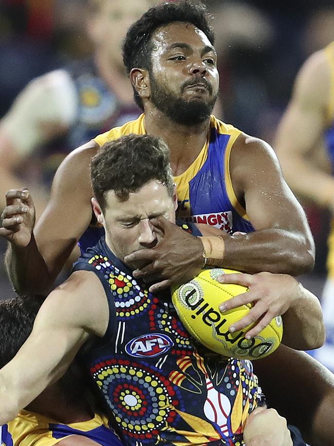 Luke Brown under pressure from Willie Rioli. Picture SARAH REED