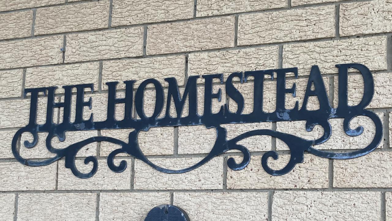 This ‘Homestead’ sign hangs at the Harristown home of Lachlan Stuart Schoenfisch and Samantha Emily Crouch. In about March the Stevens family moved in after they left their Bridge Street home. When police raided the home there were an estimated 12 adults living in the three bedroom, two bath home.