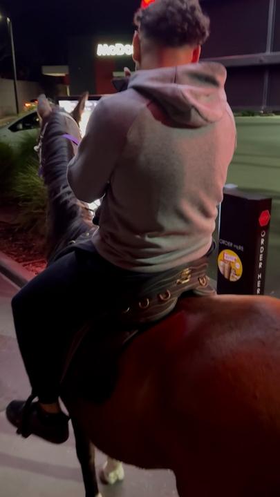 Mates ride through Macca's drive-thru on horses
