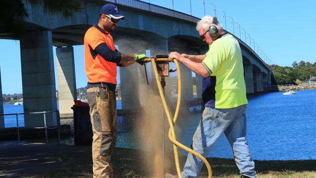 Contractors drilling holes in the soil underneath the Captain Cook Bridge in Sydney’s south as part of investigations for a controversial extension to the M1 motorway to Wollongong.