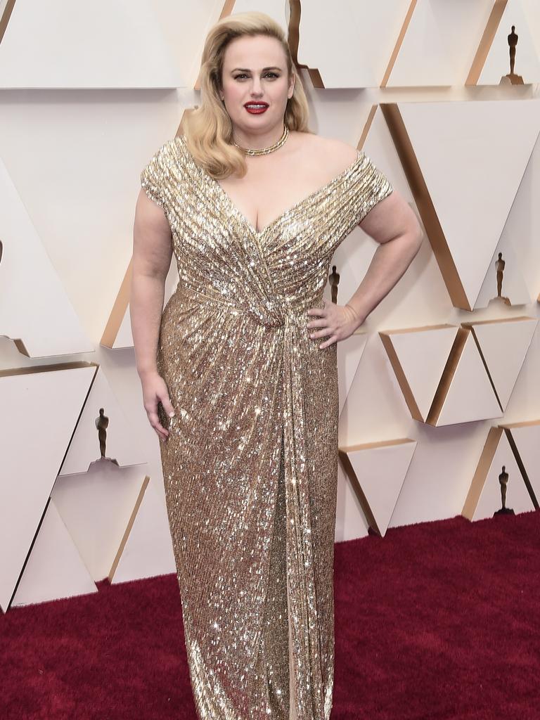 Gold, Rebel, gold ... Australian actress Rebel Wilson owns the red carpet. Picture: AP