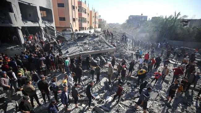 Palestinians search building rubble for survivors following Israeli strikes on al-Maghazi refugee camp in the central Gaza Strip. Picture: AFP