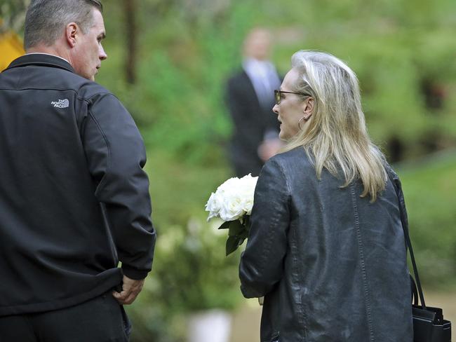 Actress Meryl Streep arrives with flowers and reportedly made a tribute speech. Picture: AP/Reed Saxon