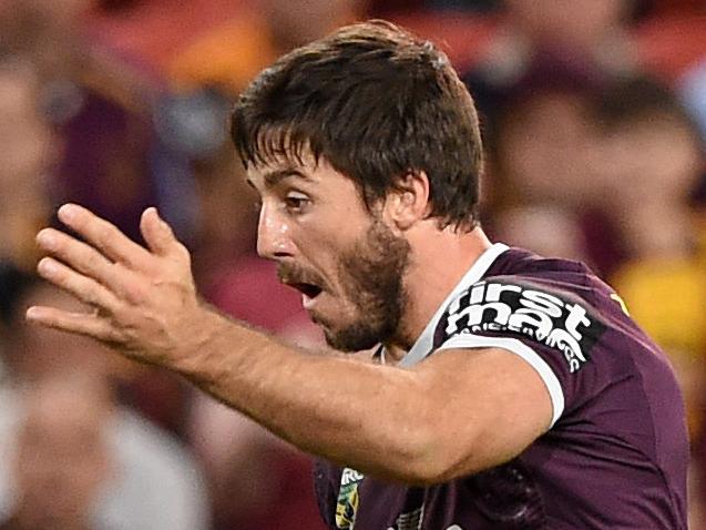 Broncos player Ben Hunt takes an unsuccessful drop goal during the Round 12 NRL match between the Brisbane Broncos and the Wests Tigers at Suncorp Stadium in Brisbane, Friday, May 27, 2016. (AAP Image/Dave Hunt) NO ARCHIVING, EDITORIAL USE ONLY