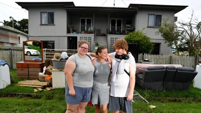 Wednesday February 13. Heavy rain causes flooding in North Queensland. Clean up after flooding in Ingham. Gabrielle Bube with daughter Davina Bube and son Kyren Riesenweb outside their unit which was inundated by floodwater.  Picture: Evan Morgan