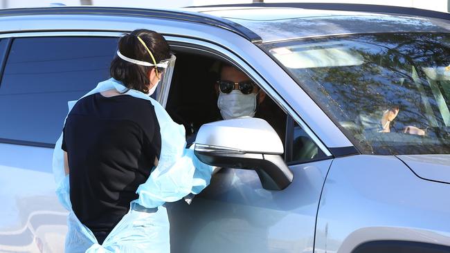 PERTH, AUSTRALIA - FEBRUARY 01: Members of the public attend the Rivervale drive thru Covid-19 testing clinic on February 01, 2021 in Perth, Australia. Lockdown restrictions are now in place across the Perth, Peel and South West regions of Western Australia following the discovery of a positive community COVID-19 case in a worker from a quarantine hotel facility.  As of 6pm on Sunday, people Perth, Peel and the South West are subject to stay at home orders, and will only be allowed to leave their homes to shop for essentials, for medical or health needs, exercise within their neighbourhood or travel to work if they cannot work from home. Face masks are now mandatory outdoors, with all restrictions to remain in place until 6pm on February 5. (Photo by Paul Kane/Getty Images)