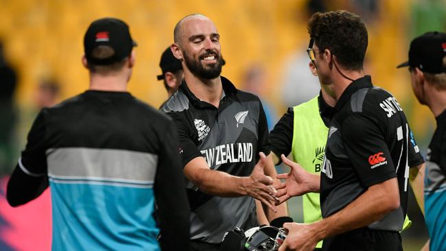 New Zealand’s Daryl Mitchell (centre) and Mitchell Santner (right) celebrate their T20 World CUp semi-final victory over England. Picture: AFP