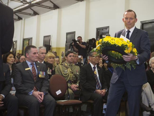 Prime Minister Tony Abbott ... lays a wreath while attending the 70th Anniversary of Victory in the Pacific Commemorative Service at ANZAC House Drill Hall, Adelaide. Picture: AAP