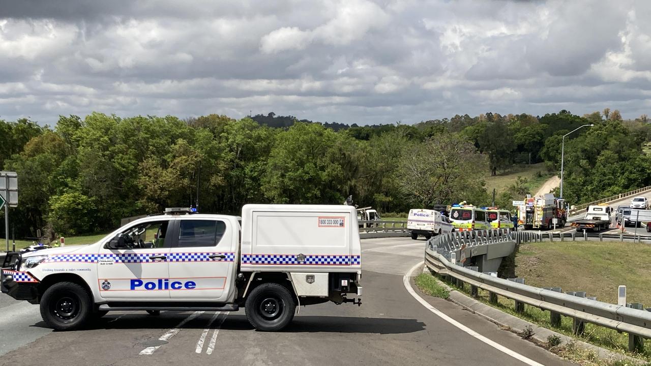 The bridge across the Bruce Hwy at Gympie was blocked for more than two hours as emergency crews worked to free the driver from the truck’s wreckage.