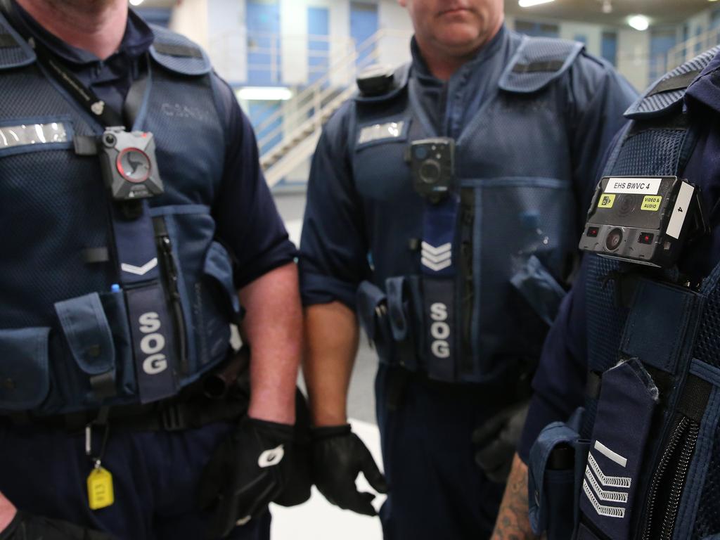 Corrective Services officers pictured with different types of body cameras currently being trialed during cell raids at Silverwater Jail whilst looking for contraband. Picture: Richard Dobson