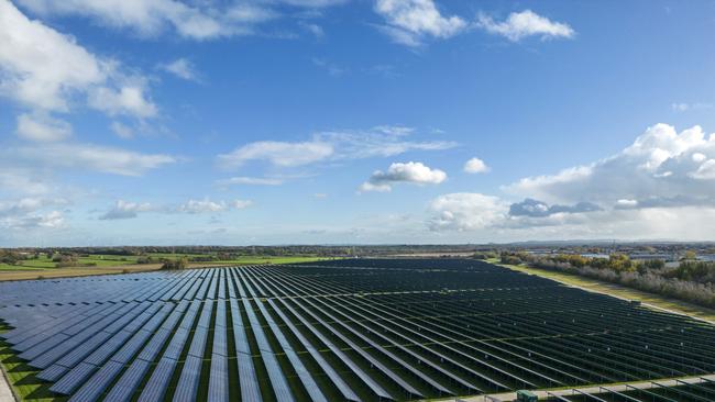 DEESIDE, WALES - NOVEMBER 09: An aerial view of the Shotwick Solar Park on November 09, 2022 in Deeside, Wales. The array of photovoltaic solar panels is spread over 250 acres and produces 72.2 mega watts per year and is also currently the largest solar farm in the UK. (Photo by Christopher Furlong/Getty Images)