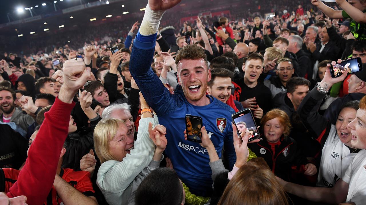 Mark Travers of AFC Bournemouth celebrates with the fans.