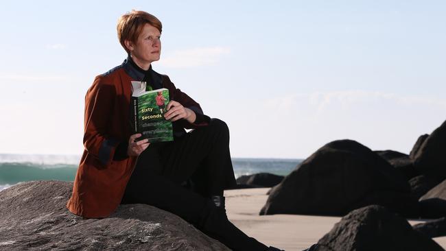 Jesse Blackadder, an author from Myocum near Mullumbimby in Northern NSW, with her book Sixty Seconds in 2017. Picture Glenn Hampson