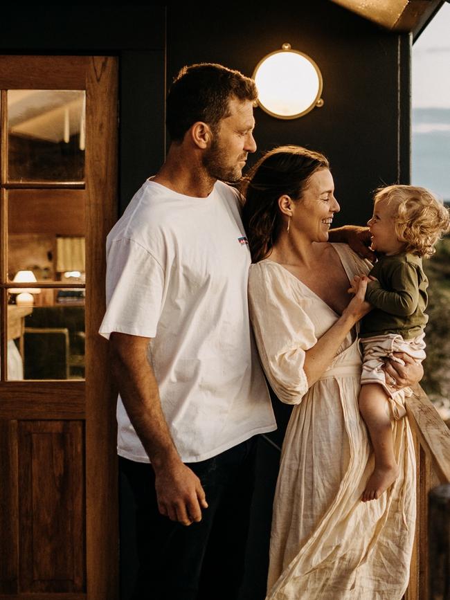 Tara and Luke Rowe pictured with one of their three children. Picture: Robert Lang