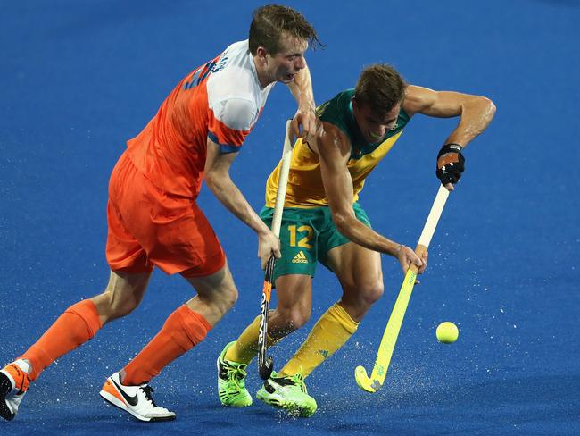RIO DE JANEIRO, BRAZIL - AUGUST 14: Jacob Whetton of Australia is challenged by Seve van Ass during the Men's hockey quarter final match between the Netherlands and Australia on Day 9 of the Rio 2016 Olympic Games at the Olympic Hockey Centre on August 14, 2016 in Rio de Janeiro, Brazil. (Photo by David Rogers/Getty Images)
