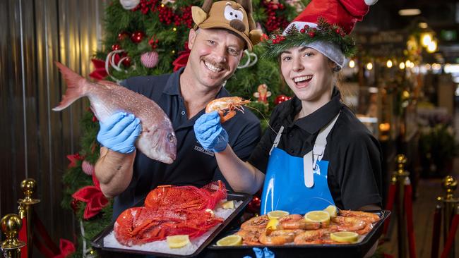 Sean Lawrence manager of Angelakis Seafood at the Central Markets who has worked their for 25years with his daughter Kaylee ,19, who has worked there for fives years with crayfish and prawns at Angelakis Seafood at the Adelaide Central Market .Thursday,December,19,2024.Picture Mark Brake