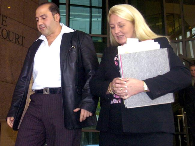 Tony Mokbel leaves Melbourne Magistrates Court with his lawyer, Nicola Gobbo. 