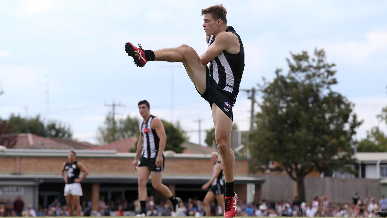 Josh Thomas boots a goal for the Magpies. Picture: Michael Klein