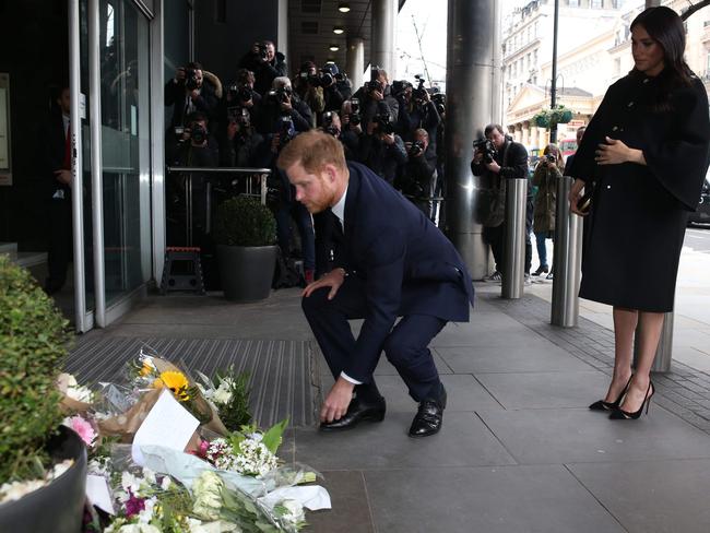 Harry lays a bouquet of flowers to honour those who died in Christchurch. Picture: AFP