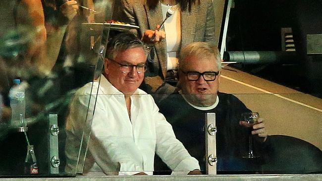 Eddie McGuire and Peter Gordon watch Collingwood take on Western Bulldogs from a private box in Round 1. Picture: Mark Stewart