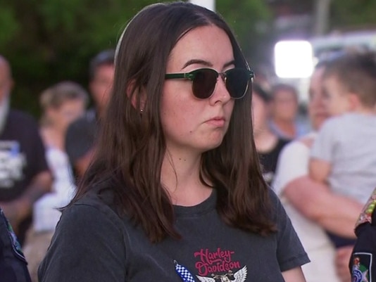 Constable Keely Brough honouring the victims of the attack at a candlelight vigil service in the nearby town of Chinchilla. Picture Seven News