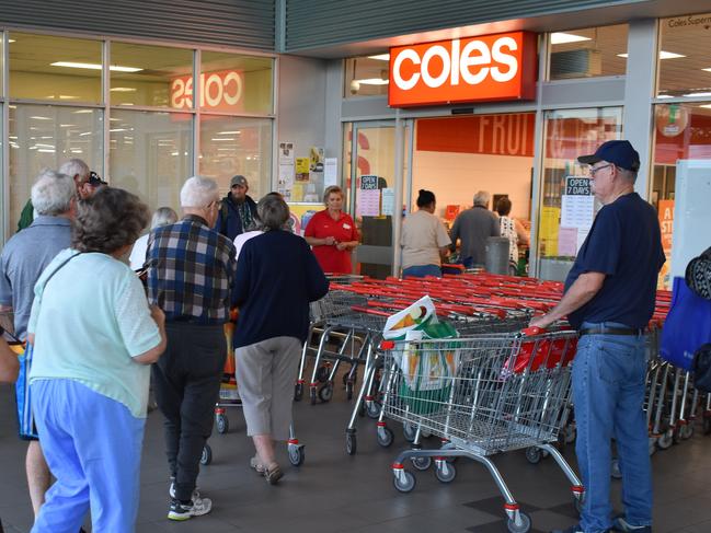 Shoppers in Casino at Coles and Woolworths in the 'elderly hour' before supermarkets open to everyone, were calm and orderly.