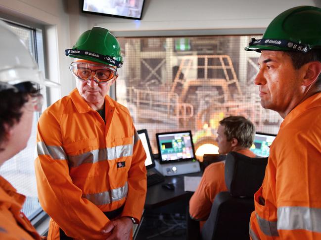 SA Premier Jay Weatherill (C) and Energy Minister Tom Koutsantonis along with Olympic Dam Asset President Jaqui McGill (L) at the Olympic Dam smelter in the far north of South Australia, Thursday, February 8, 2018. Mining giant BHP has marked the completion of upgrade work at its Olympic Dam project in South Australia with a plan to return to full production. (AAP Image/David Mariuz) NO ARCHIVING