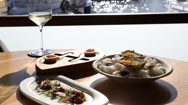 Clockwise from rear: bottoni with jamon iberico, oysters with melon and dill and parmesan gel salad. Pictures: Damian Shaw.