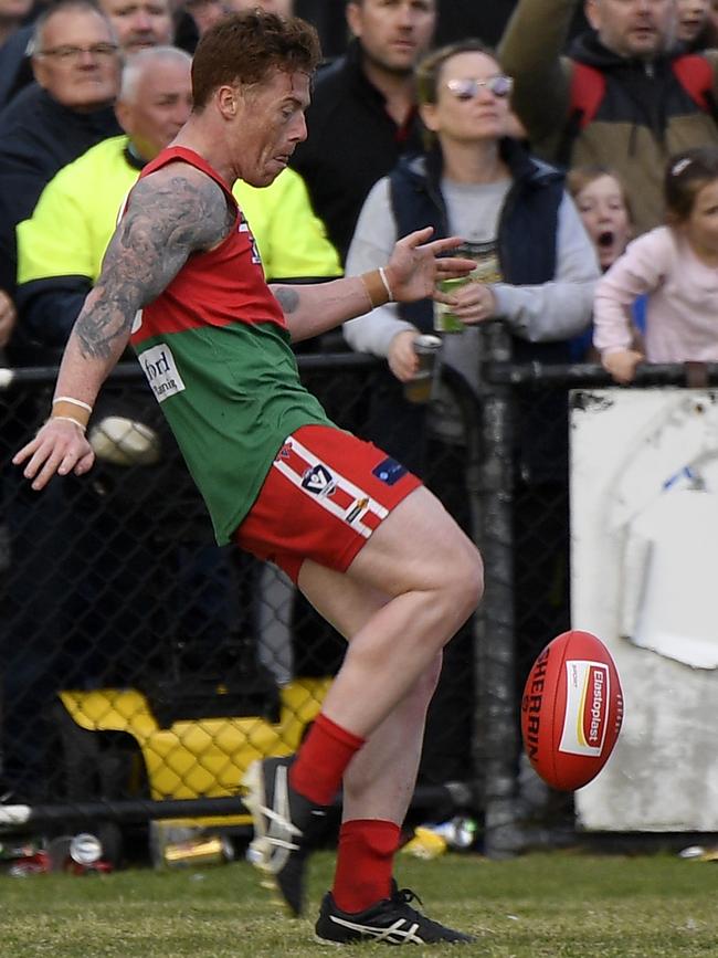 Aaron Ludewig kicks the winning point. Picture: Andy Brownbill