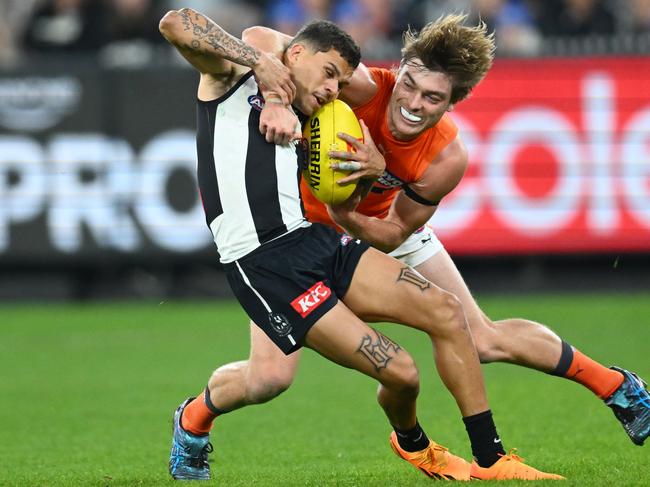 Cam Fleeton tries to bring Collingwood’s Bobby Hill down. Picture: Quinn Rooney/Getty Images