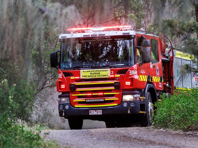 MELBOURNE, AUSTRALIA - Newswire Photos December 16, 2024: Firemen attending a small grass fire below the Westgate Bridge in Melbourne.. Picture: NewsWire / Aaron Francis