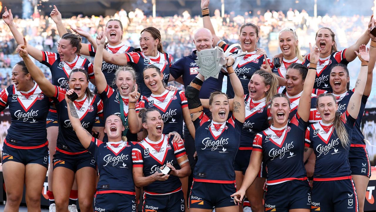 SYDNEY, AUSTRALIA – OCTOBER 06: Roosters players celebrate with the NRL Women's Premiership Trophy after winning the NRLW Grand Final match between Sydney Roosters and Cronulla Sharks at Accor Stadium on October 06, 2024, in Sydney, Australia. (Photo by Cameron Spencer/Getty Images)