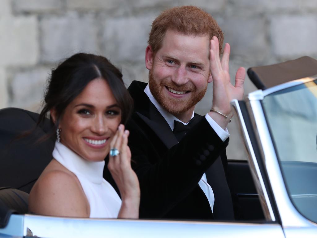 Duchess of Sussex and Prince Harry, Duke of Sussex wave as they leave Windsor Castle after their wedding. Picture: Steve Parsons – WPA Pool/Getty Images