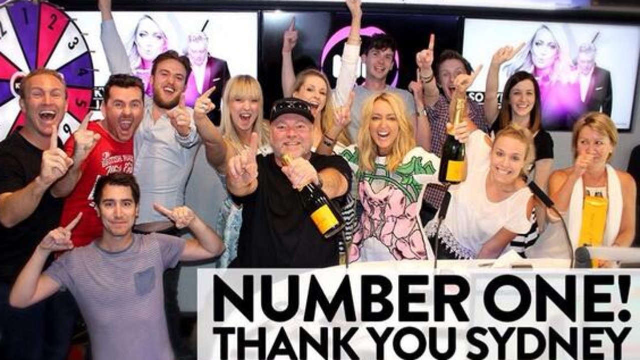 Kyle and Jackie O celebrating their first round of radio ratings at KIIS FM.
