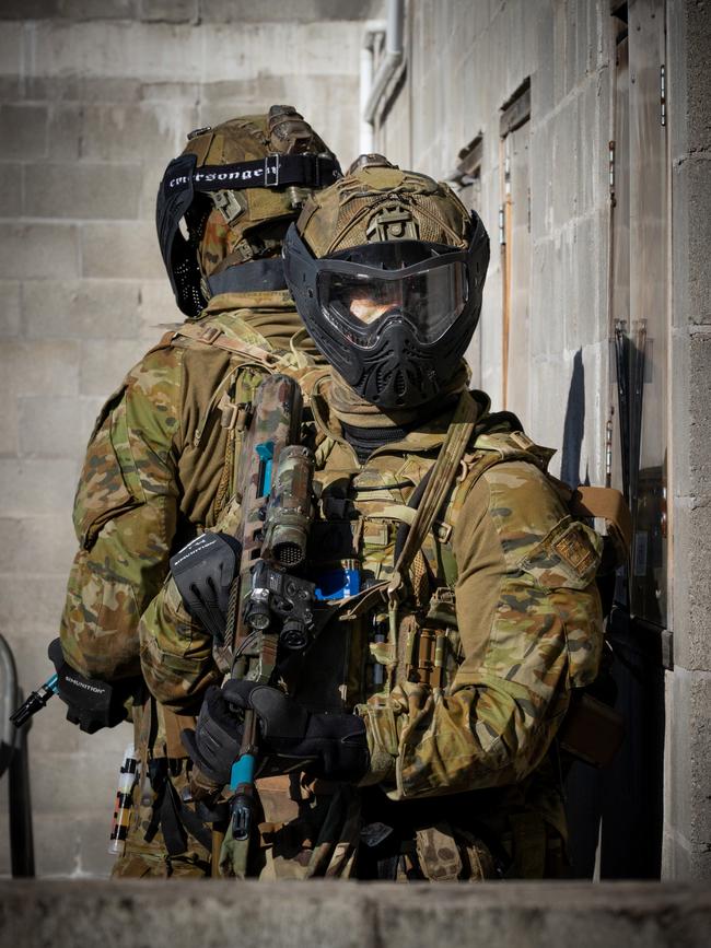 Australian army soldiers from the 3rd Battalion, Royal Australian Regiment, provide security outside a building during the conduct of an urban assault serial using the Blue Bolt non-lethal training ammunition, as part of the 2022 Duke of Gloucester Cup in Singleton. *** Local Caption *** Australian Army infantry soldiers from across Australia tested their core skills for the prestigious Duke of Gloucester Cup at the School of Infantry, near Singleton in NSW, July 31 - August 5 2022. The Duke of Gloucester Cup is the Armyâ€™s premier military skills competition, pitting the best Royal Australian Corps of Infantry rifle sections from each unit against one another through a series of challenging activities that test their core infantry skills, including marksmanship, tactics, teamwork and fitness. Along with the Duke of Gloucester Cup, five other trophies are awarded: Sir Arthur MacDonald Trophy for best foundation war-fighting skills; Gurkha Trophy for best live-fire shooting; Royal Ulster Rifles Trophy for best falling plate shooting; OSCMAR Trophy for best battle endurance; and the DSM Roche CSC Memorial Cup for best individual soldier. The Duke of Gloucester Cup was created by Prince Henry, Duke of Gloucester, in 1946, while serving as the Governor-General of Australia.
