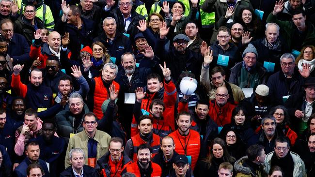 Construction workers gathered in the cathedral to celebrate a job well done. Picture: AFP