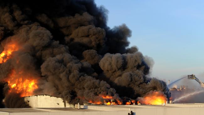 An out of control fire rages through factories around Thornycroft Street Campbellfield. Picture: Andrew Henshaw