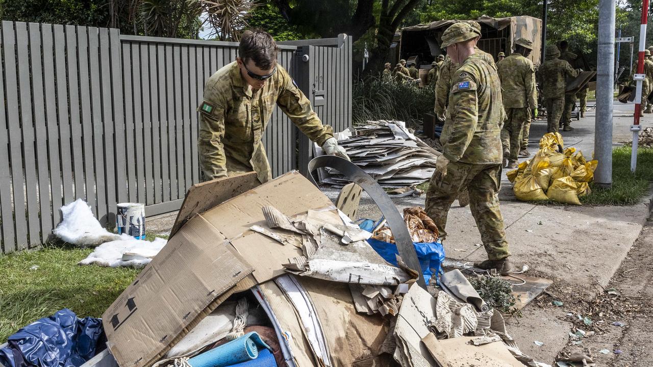 Soldiers help with flood clean-up in the inner Brisbane suburb of Milton. Picture: NewsWire / Sarah Marshall