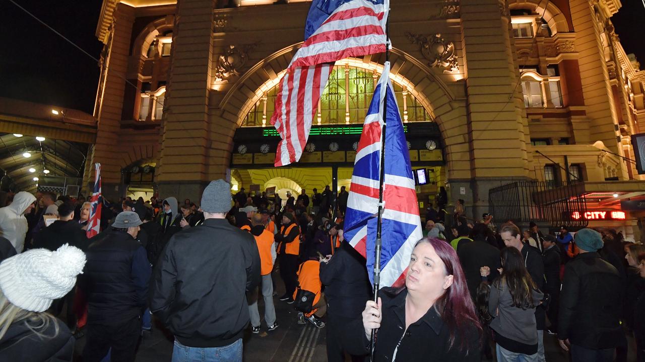 Protesters gather at Flinders Street Station on Thursday evening to protest the looming lockdown. Picture: Jason Edwards