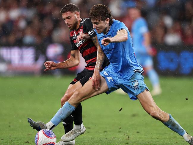 SYDNEY, AUSTRALIA - MARCH 02: Max Burgess of Sydney FC wins the ball during the A-League Men round 19 match between Western Sydney Wanderers and Sydney FC at CommBank Stadium, on March 02, 2024, in Sydney, Australia. (Photo by Mark Kolbe/Getty Images)