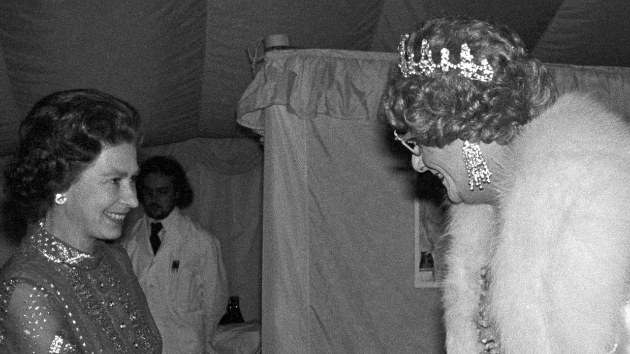 Queen Elizabeth II meets Dame Edna Everage at Windsor during the Queen's Silver Jubilee Appeal. (Photo by PA Images via Getty Images)